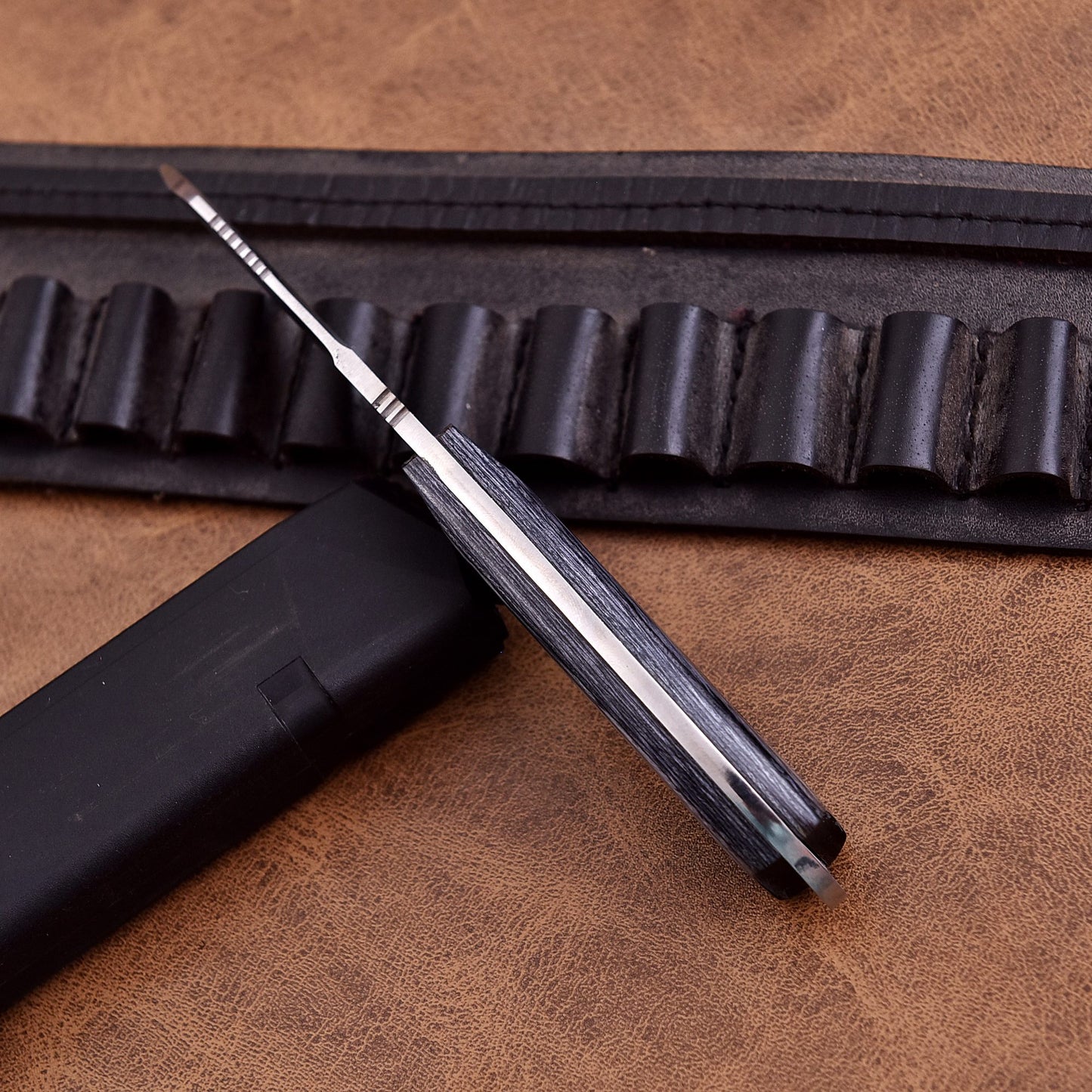 High quality handcrafted hunting knife with durable sheath and ergonomic grip.