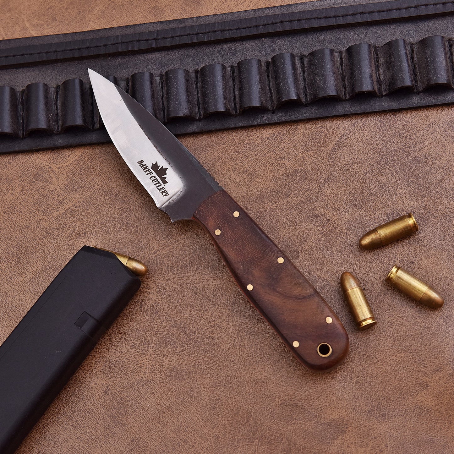 Close-up of the ergonomic ironwood handle for enhanced grip on Pathfinder Knife.
