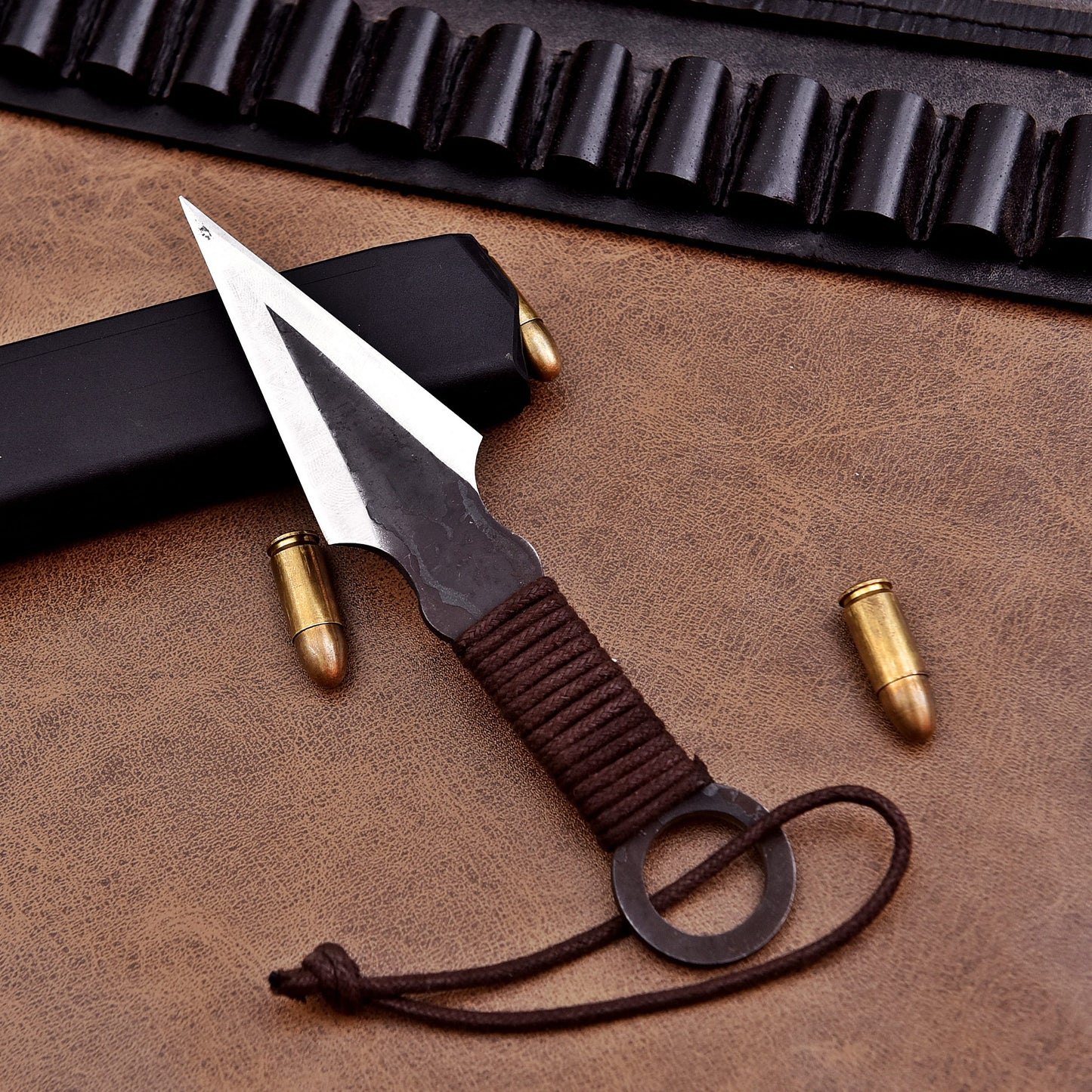 Tactical throwing knife with ergonomic grip, razor-sharp edge, and leather sheath.
