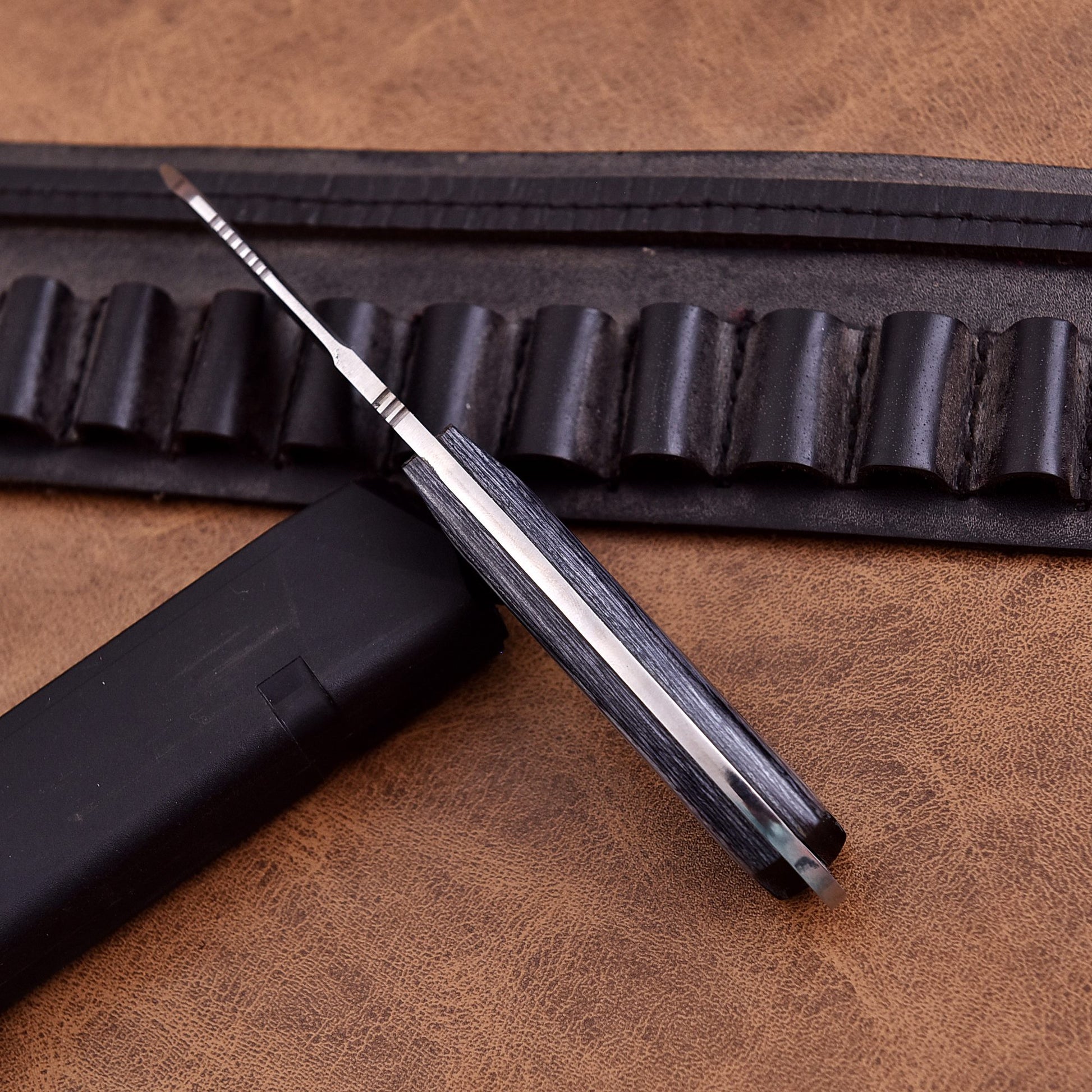High quality handcrafted hunting knife with durable sheath and ergonomic grip.