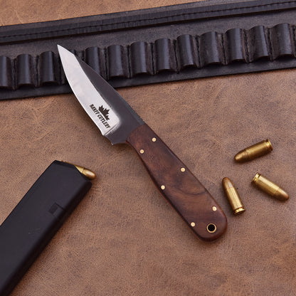 Close-up of the ergonomic ironwood handle for enhanced grip on Pathfinder Knife.