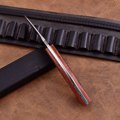 Professional skinning knife with unique micarta grip and sharp hunting blade.