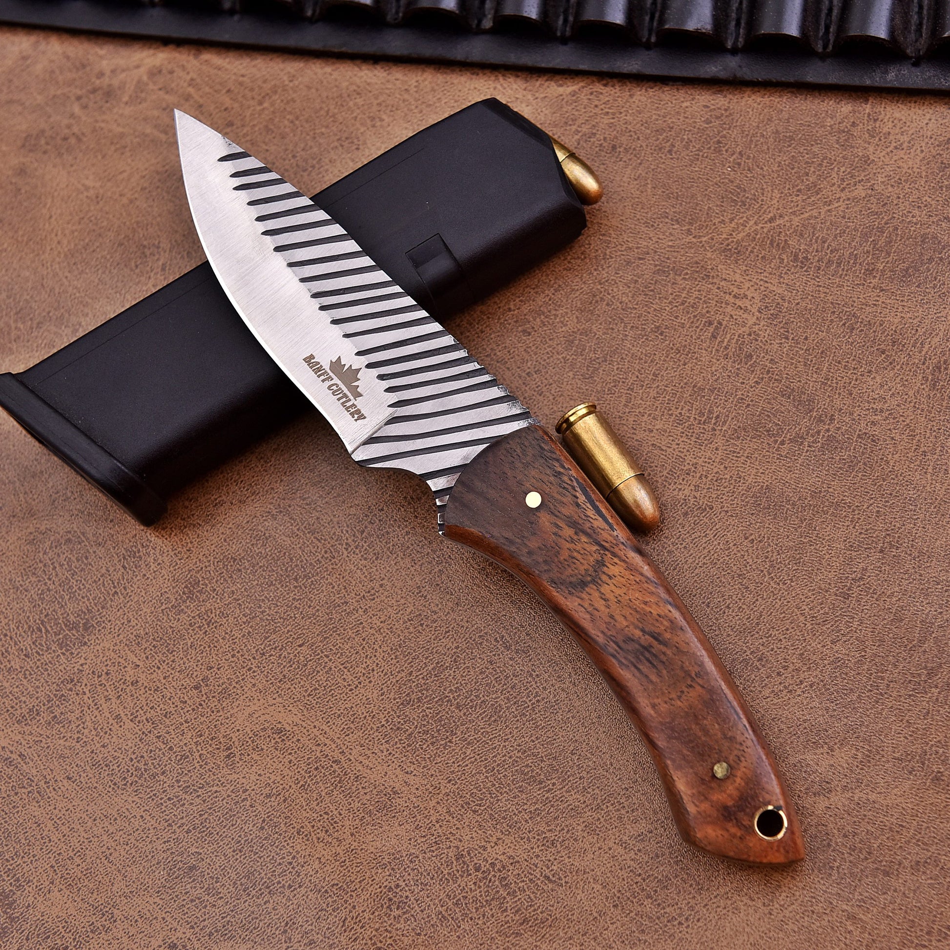 Showing the sleek Bowie-style blade, designed for powerful and precise cuts.