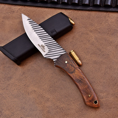Showing the sleek Bowie-style blade, designed for powerful and precise cuts.