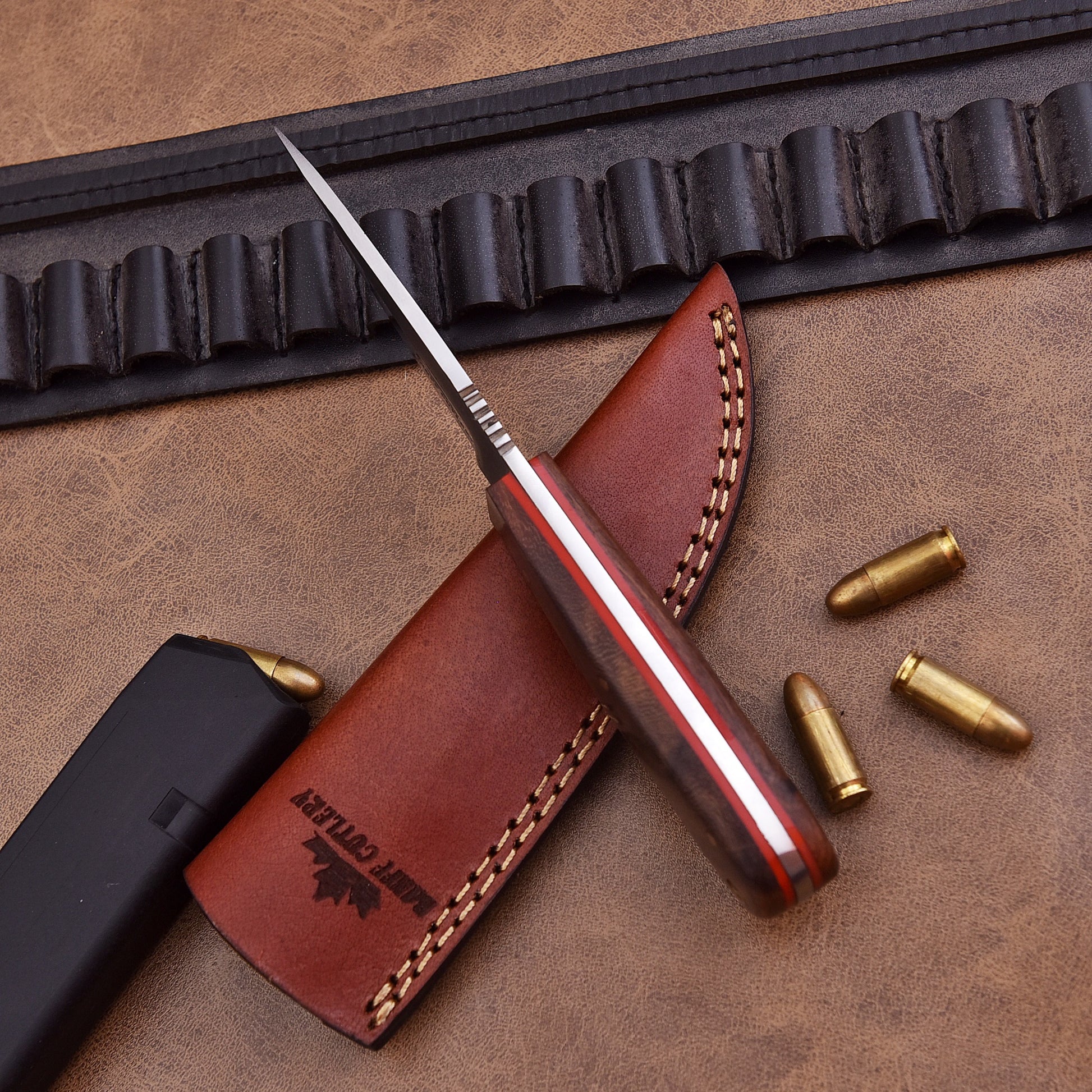 Sharp 4-inch D2 steel blade of Pathfinder Knife for precision cutting in survival tasks.