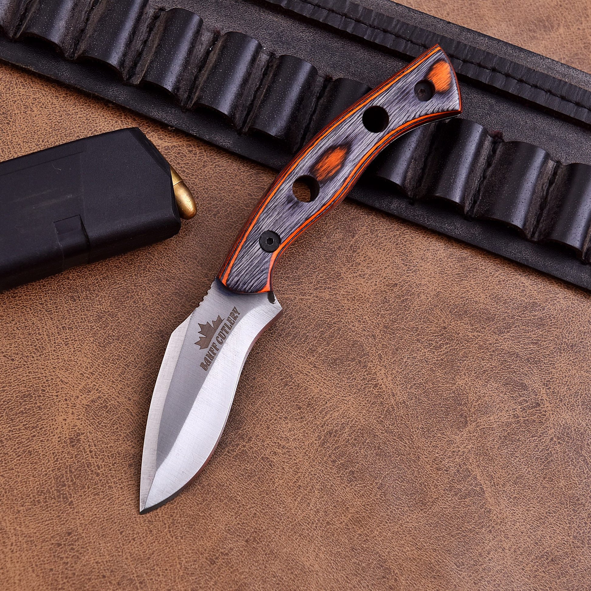 Handcrafted outdoor survival knife with ergonomic handle for camping and bushcraft.