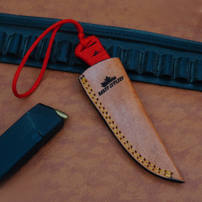 Versatile utility knife with razor-sharp D2 steel blade, ergonomic paracord handle, and leather sheath for skinning and outdoor tasks.